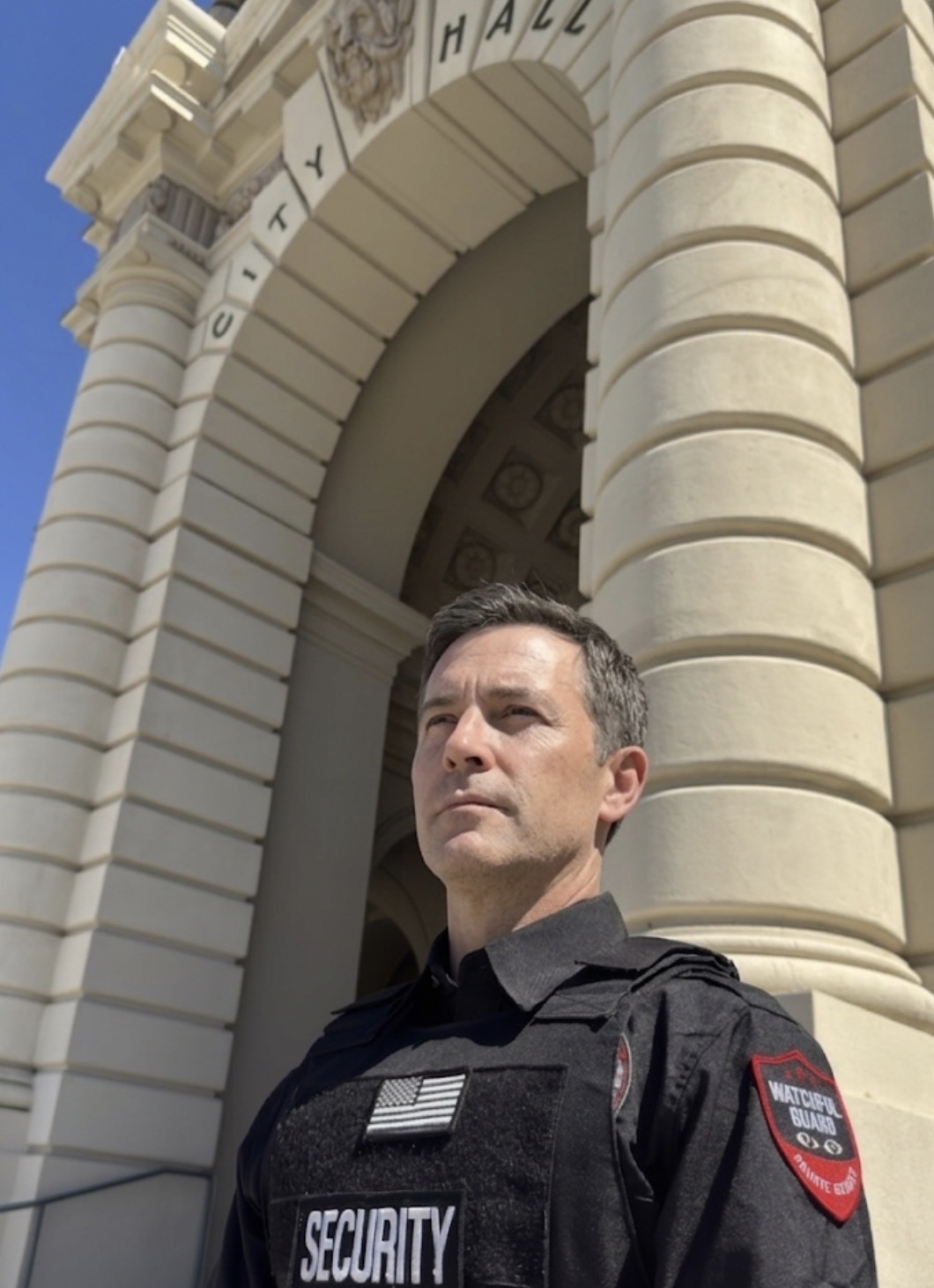 DPS licensed commercial security officer at a building lobby entrance